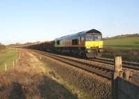 Colas Rail Class 66 no 66843 heads west passed Gregson Lane towards the WCML with the daily Carlisle to Chirk log train on 1 March 2011.<br>
<br><br>[John McIntyre 01/03/2011]