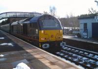 EWS 67005 hauling the Rail-Blue Charters <I>'Winter Highlander'</I> from Darlington to Inverness, photographed at Carrbridge station on 11 March 2011<br><br>[Gus Carnegie 11/03/2011]