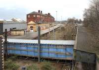 This is the part of Crewe station that most passengers don't normally see. These former through tracks and platforms located on the west side of the station are now truncated, with a covered scaffolding walkway crossing the formation. Photographed on 12 March 2011.<br><br>[John McIntyre 12/03/2011]