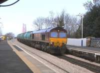 66 003 brings an aviation fuel train off the Forth Bridge and through Dalmeny station on 16 March 2011 before taking the Winchburgh line.<br><br>[David Panton 16/03/2011]