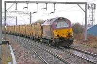 67004 leans into the curve approaching Prestonpans on 17 March with the 6B45 Powderhall - Oxwellmains <I>Binliner</I> refuse containers.<br><br>[Bill Roberton 17/03/2011]