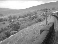 Northbound over Dent Head Viaduct on 9 July 1961. The train is the  R.C.T.S. (West Riding Branch) 'Borders Rail Tour' behind 46247 <I>City of Liverpool</I>. The special will soon pass Dent Head signal box, which is partially obscured by the nearest telegraph pole.<br><br>[K A Gray 09/07/1961]