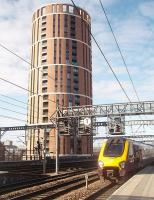 This imposing tower block overlooks the west end of Leeds station. Presumably resident enthusiasts opt for flats on this side of the building. Cross Country Voyager 220026 runs in from the south.  <br><br>[Mark Bartlett 19/03/2011]