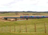 The 10.00 Manchester Airport - Edinburgh Waverley TransPennine DMU crosses Float Viaduct over the River Clyde on 21 March on the south eastern approach to Carstairs.<br><br>[John Furnevel 21/03/2011]