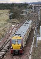 <I>White Elephant East Junction....?</I>  334 002 passes the eastern connection to the cancelled STVA car terminal on 26 March with the 17.01 from Bathgate to Edinburgh Waverley. [See image 18357]<br><br>[Bill Roberton 26/03/2011]