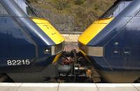 <I>'We have to stop meeting like this...' </I> East Coast DVT 82215 and power car 91108 face up at Waverley with an empty stock working to London on 29 March.  The DVT was defective, hence the 91 leading 'blunt end' first.<br>
<br><br>[Bill Roberton 29/03/2011]