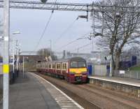 320 320 runs into Easterhouse station with an Airdrie service on 26 March 2011.<br><br>[David Panton 26/03/2011]