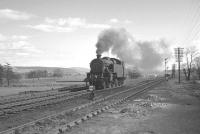 <I>'Right then - deep breaths...'</I>  Fairburn 2-6-4T no 42214 getting psyched up for the task in hand at Beattock South on 15 April 1963. Standing up ahead is 46247 <I>City of Liverpool</I> with the heavy 10am Euston - Perth awaiting the arrival of assistance before tackling the climb to Beattock summit [see image 28174].<br><br>[K A Gray 15/04/1963]