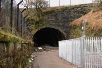 The tunnel giving access to the former goods depot adjacent to Greenock Lynedoch station. The goods yard is behind the camera. From here the goods line climbed to Ann Street Tunnel camera where it joined the main line. The former goods depot site is now occupied by the Lynedoch Industrial Estate. [See image 33483]<br><br>[Graham Morgan 22/03/2011]
