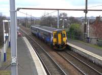 156 502 approaches Bellshill with a stopping service from Edinburgh to Glasgow Central on 26 March. Giving a continental flavour this unit has for years sported an 'NL' sticker above the offside window!<br>
<br><br>[David Panton 26/03/2011]