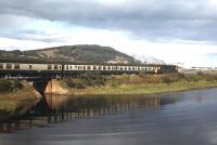 A Wick/Thurso-Inverness train accelerates away from Clachnaharry in the summer of 1980. Note the <I>'mini-buffet'</I> coach (third from the engine), which offered Britain's shortest journey in a refreshment car at one third of a mile - between Invershin and Culrain stations.<br><br>[Frank Spaven Collection (Courtesy David Spaven) //1980]