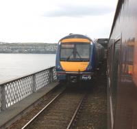 Out on the Tay Bridge on 15 April unit 170414 will shortly reach the high girders with an Edinburgh bound service, as the Compass railtour heads north near the end of the outward leg of its journey from Blackpool.<br><br>[John McIntyre 15/04/2011]