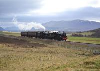 On one of the long straights north of Dalwhinnie, Black 5s 45407 <I> The Lancashire Fusilier </I> and 44871 haul support coaches towards Inverness.<br>
<br><br>[John Gray 17/04/2011]
