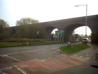Almost fifty years after closure, the Midland Railway's viaduct on their Leicester line out of Rugby still strides purposefully across - Leicester Road. View south in March 2011.<br><br>[Ken Strachan 29/03/2011]