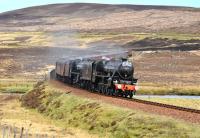 <I>The Great Britain IV</I> south of Kinbrace on 18 April with Black 5s 44871 and 45407 <I> The Lancashire Fusilier </I> having just crossed the River Helmsdale. Discreetly tagged on at the tail end is 47 760.<br>
<br><br>[John Gray 18/04/2011]