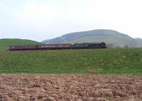 46115 with support coaches passes Craig Rossie on 20 April on the approach to Auchterarder.<br><br>[John Robin 20/04/2011]