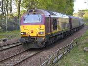 DBS 67003 coasts downhill to its stop at Dalgety Bay with the 17.08 Edinburgh-Fife-Edinburgh on 25 April. At left is the coping stone of the bridge over the Fordell Railway, now removed and infilled.<br>
<br><br>[Bill Roberton 25/04/2011]