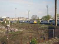 DBS <I>Fertis</I> liveried class 56 locomotives, previously employed in France on construction of new high speed routes, now stored at the south end of the former Crewe Diesel Maintenance Depot. Photographed from a passing Crewe - Shrewsbury all stations shuttle service on 18 April 2011.<br><br>[David Pesterfield 18/04/2011]
