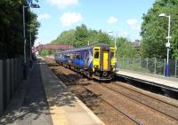 A sunny, warm May Day bank holiday in Glasgow sees an East Kilbride service, formed by unit 156 436, preparing to pull away from the platform at Giffnock.<br><br>[David Panton 02/05/2011]
