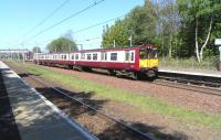314 203 heading for Glasgow at Hillington West on 2 May 2011.<br><br>[David Panton 02/05/2011]