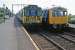 Class 312 EMU meets Class 105 DMU at Kirby Cross on 30th July 1983. A  rare sight on the Thorpe le Soken to Walton on the Naze line, the DMU was forming the Great Eastern railtour which included Sudbury, St Botolphs, Walton on the Naze, Clacton and Felixstowe in its itinerary.<br><br>[Mark Dufton 30/07/1983]