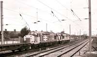 Class 37s 37511+37504 head a northbound freight through Thirsk on 18 August 1989, as an up HST is about to pass with an ECML service bound for Kings Cross.<br>
<br><br>[Peter Todd 18/08/1989]