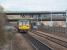 With the M1 Tinsley viaduct in the background 142087, heading for Swinton, races a Sheffield Supertram away from Meadowhall. The tram will swing right before the bridge to return to the city centre while the Pacer is bound for Doncaster and Scunthorpe.<br><br>[Mark Bartlett 19/03/2011]