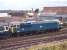 56008 moves away from Melton Mowbray station on 24 July 1977 with the empty stock of the <I>Melton Mowbray Pieman</I> special from Barnsley [see image 32896].<br><br>[Bill Jamieson 24/07/1977]