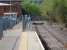 'Lines end' at Maesteg in April 2011, with a detached buffer assembly and chained sleepers acting as a stop barrier. The old trackbed beyond is well used to access Asda and the town using a gap created in the palisade fence behind the trees on the right, and then walking alongside the fence on left to access the platform via the ramp.<br><br>[David Pesterfield 20/04/2011]