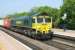 Freightliner 66543 brings an eastbound container train through Cholsey on 21 April 2011.<br><br>[Peter Todd 21/04/2011]