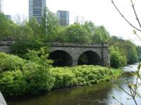 Part of the former Glasgow Central Railway viaduct over the River Kelvin, seen looking east from Kelvindale Road in May 2011. To the left was Dawsholm, which lost its passenger service as long ago as 1908 but remained open to goods traffic for a further 60 years. The former GCR route to Bellshaugh Junction headed off to the right.<br><br>[Veronica Clibbery 07/05/2011]