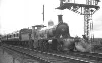Highland Railway <I>Jones Goods</I> 4-6-0 no 103 together with the preserved Caledonian coaches standing at signals at Aviemore station on 30 August 1965. The locomotive and coaches were returning south with the 1.35pm Inverness - Perth special working [see image 31765].<br><br>[K A Gray 30/08/1965]