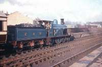 Scene at Lanark station on 26 April 1958 with ex-CR 4-2-2 no 123 about to leave with the <I>'Caledonian 123 Excursion'</I> to Muirkirk. [See image 32807]<br><br>[A Snapper (Courtesy Bruce McCartney) 26/04/1958]
