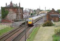 The 12.16 Largs - Glasgow Central restarts after calling at Saltcoats  on 17 May 2007. The station, the third to serve Saltcoats, was opened in 1882, although the town's New Trinity Church in the background pre-dates it by more than a century.<br>
<br><br>[John Furnevel 17/05/2007]
