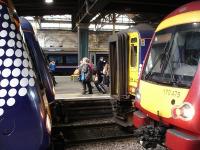 Odd one out times two. 170434 for Dundee in Saltire livery and 170458 for Glasgow Queen Street become blocked in at Waverley west end shortly after mid-day on 10 May by new arrivals 156442 also in Saltire livery plus SPT liveried 170475.<br><br>[David Pesterfield 10/05/2011]