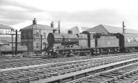 Fowler 0-6-0 no 44399 shunting a sleeping car at the south end of Carlisle station in the summer of 1962.<br><br>[K A Gray 04/08/1962]