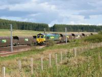 A Freightliner Class 66 brings coal empties north over Beattock <br>
Summit on 30 May 2011, while another Freightliner is held in the up loop with a loaded train from  Ravenstruther destined for Drax Power Station.<br><br>[John McIntyre 30/05/2011]