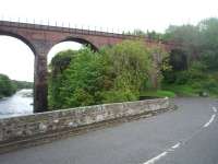 Two bridges in retirement in May 2011. In the foreground is the old A75 road bridge, which since the Glenluce bypass was completed has only carried a farm access road. Beyond, also spanning the River Luce, is the single track railway viaduct that carried <I>The Port Road</I> until closure in 1965.  <br><br>[Mark Bartlett 23/05/2011]