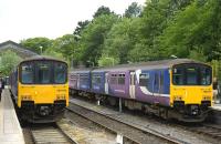 Class 150 DMUs standing at Buxton Station on 4 June 2011.<br><br>[Peter Todd 04/06/2011]