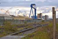 The little-used tracks leading to Rosyth Dockyard on the evening of 8 June 2011. Trains may return if Babcock Rosyth is successful with plans for an international container terminal. In the background is the Chinese-built 1000 tonne capacity 'Goliath' crane, being prepared for use in assembling aircraft carriers.<br>
<br><br>[Bill Roberton 08/06/2011]