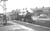 Ivatt 2-6-0 no 43121 taking water at Haltwhistle during a break in the BLS/SLS <I>'Scottish Rambler no 6'</I> railtour on 26 March 1967. The locomotive was in charge for the section which included a return trip over the Alston branch [see image 29676].<br><br>[K A Gray 26/03/1967]