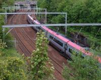 A Virgin Pendolino heads south east away from Uddingston during the evening of 9 June 2011.<br><br>[John Steven 09/06/2011]