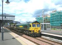 Freightliner 66604 southbound through Stirling station on 10 June 2011 with returning coal empties from Longannet power station heading for Hunterston.<br><br>[Veronica Clibbery 10/06/2011]