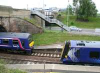 One of the class 322s long associated with the North Berwick line meets one of the new class 380 replacements at Musselburgh on 11 June 2011.<br><br>[John Furnevel 11/06/2011]