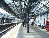 View north along platform 3 at Stirling station on 10 June as passengers await the arrival of the 14.21 service to Glasgow Queen Street.<br><br>[Veronica Clibbery 10/06/2011]