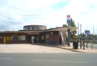 Hoylake's Art Deco station building dates from the 1938 electrification and the building has been Grade II listed since 1988. The circular <I>clerestory</I> over the booking hall is a notable feature and to the right the level crossing can be seen. <br><br>[Mark Bartlett 11/06/2011]