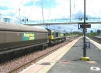 Freightliner 66604 rumbles through Stirling on 11 June with coal empties from Longannet power station heading back to Hunterston import terminal for a refill. <br><br>[Veronica Clibbery 11/06/2011]