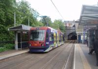With the opening of the Midland Metro tramway in 1999 there were four tracks again on a section of the old GWR main line from Snow Hill to Wolverhampton. With Hockley tunnels just ahead, Tram No.4 calls at Jewellry Quarter on its way to Birmingham. The main line platforms lie just to the right of this picture [See image 34473].  <br><br>[Mark Bartlett 08/06/2011]