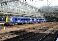 A 7 car 380 leaves Platform 9 at Glasgow Central on 19 May on what is thought to be an empty stock movement. 380006 is leading the train.<br><br>[Colin Miller 19/05/2011]