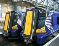 380s at Glasgow Central on 20 June. 380106 and 380113 stand at the buffer stops.<br><br>[Veronica Clibbery 20/06/2011]